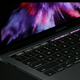Ilustración para el artículo titulado El nuevo MacBook Pro tiene una pantalla en el teclado que cambia según lo que necesites